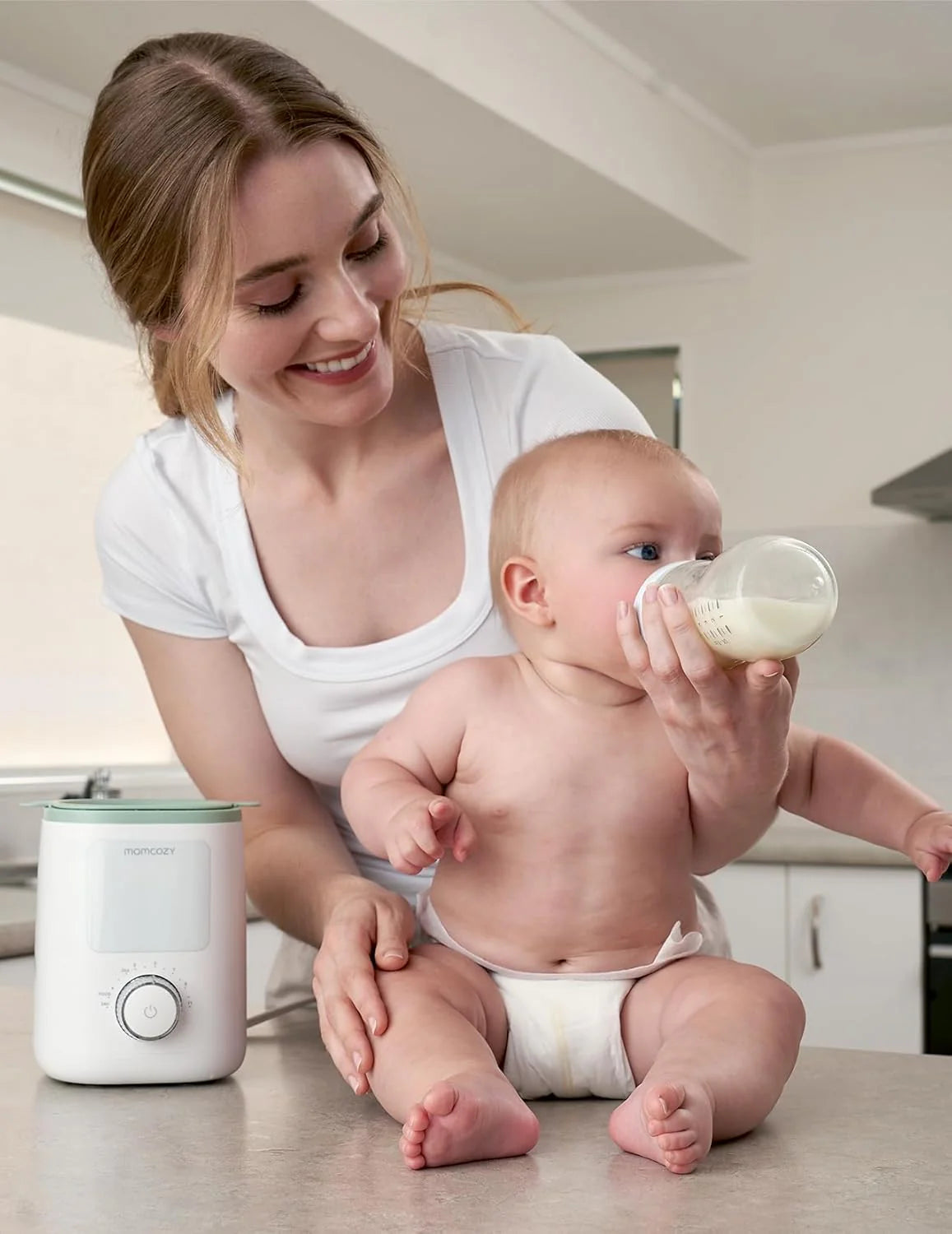 Momcozy Nutri Smart аналоген, мултифукнционален грејач за шишиња